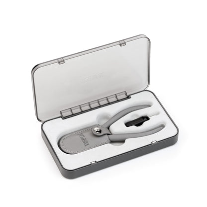 Silver nail clipper set in an open gray case on a white background